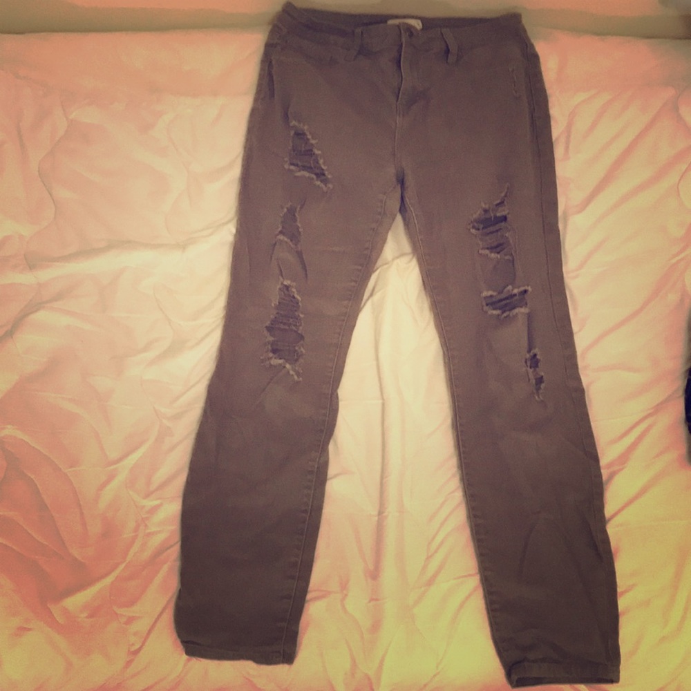 Distressed army-green skinny jeans